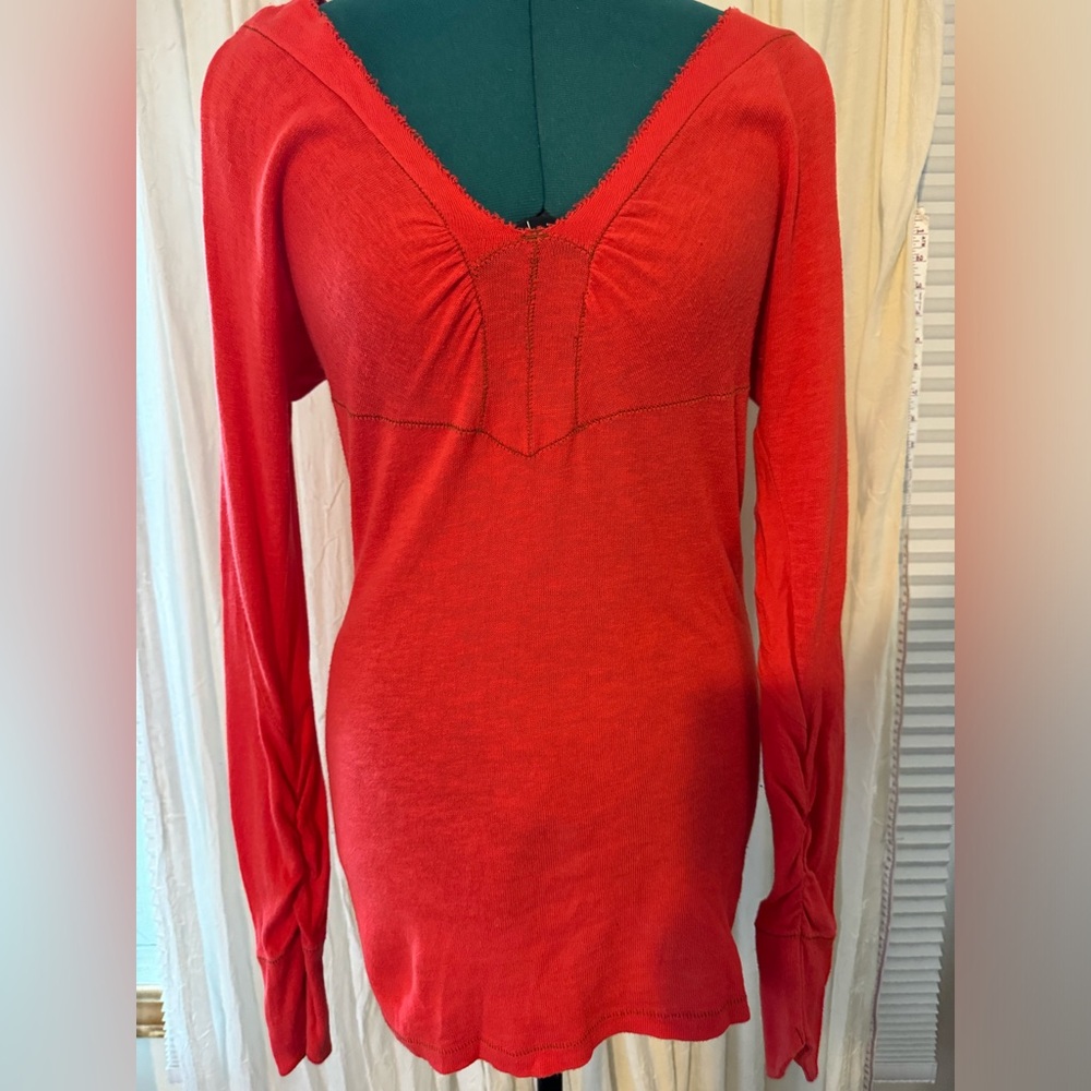 Free People. Long-sleeve top with vertical cold shoulder slits.